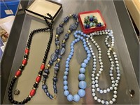 costume jewelry blue, black and red necklaces,
