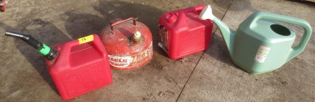 3 gas cans and a sprinkling can