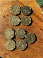 4 Australian $1 coins and 5 New Zealand $1 coins