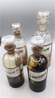4 Antique Pharmacy Bottles Fluorescing Stoppers