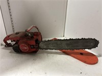 Red homelite chainsaw with orange guard