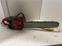 Homelite chainsaw with yellow blade cover