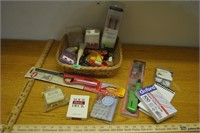 wicker basket with command strips, lighters, misc