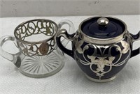 Sterling silver details on creamer and sugar pot