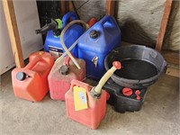 Several gas cans and oil drain pan