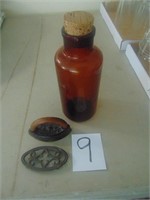 child sad iron with trivit and brown medicine jar