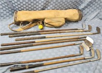 8 Vintage wooden shaft golf clubs with bag,