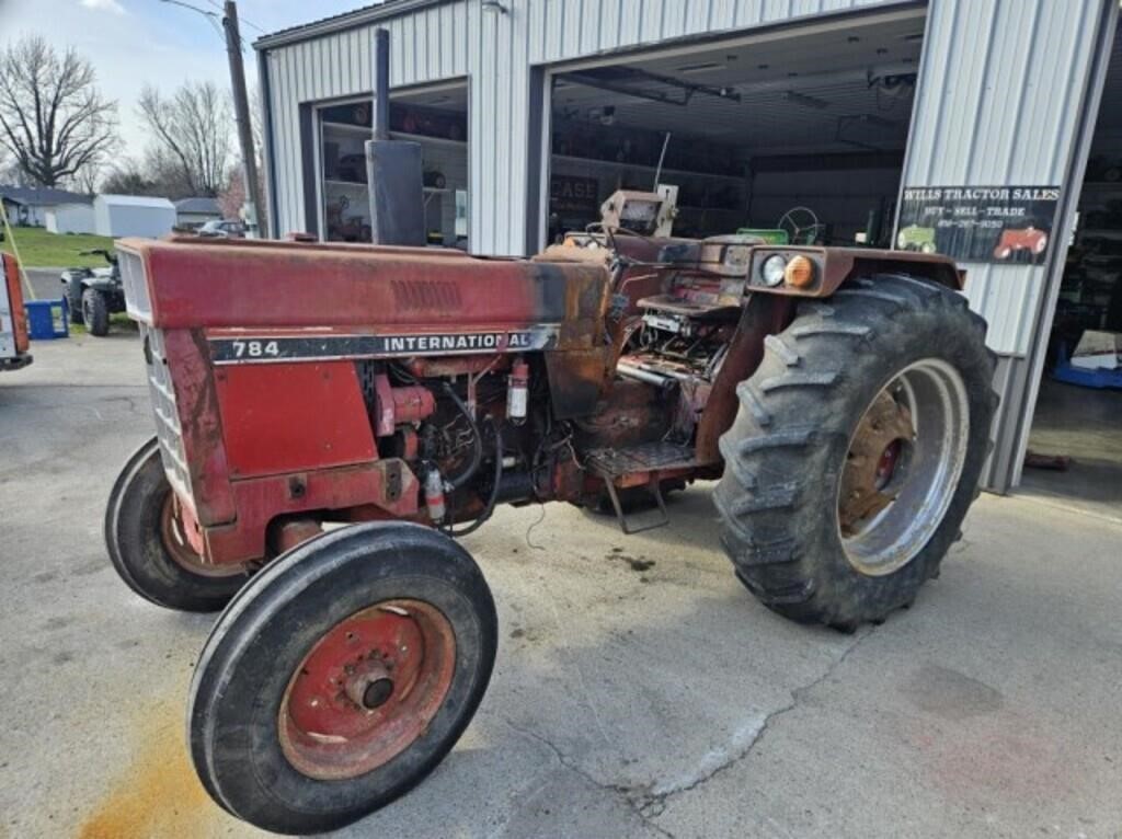 IH 784 W/Rear weights, tractor had a small dash