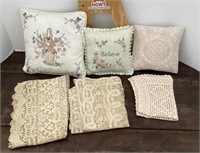 Decorative pillows and lace doilies