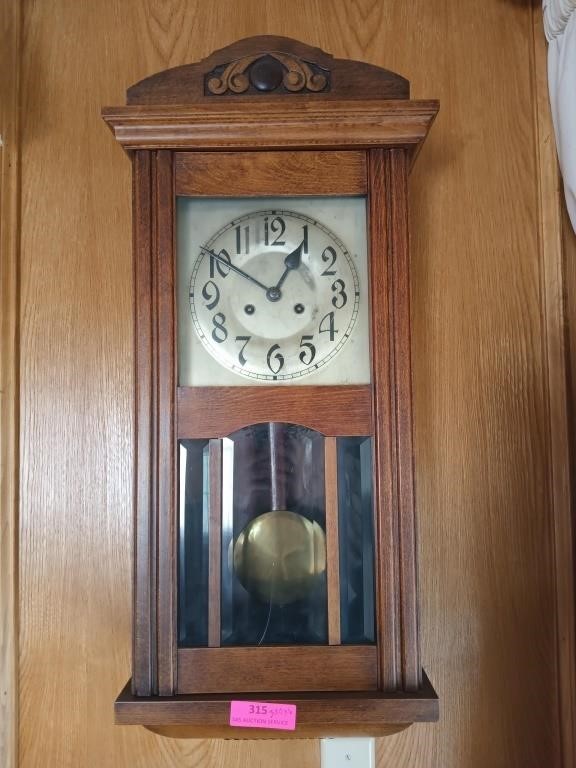Oak pendulum wall clock with key, beveled glass -
