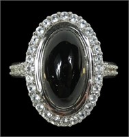 Sterling silver bezel set oval cabochon ring with