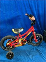 A tricycle measures to be 35" long x 25" tall x