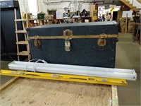 A large chest that measures to be 34" x 16.5" x