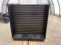 Black slat wall display case with shelving and