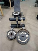 Adjustable weight bench with weights and bar.