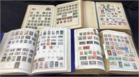 (4) BOOKS FULL OF STAMPS FROM AROUND THE WORLD,