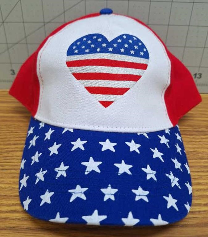 New childs hat with heart flag