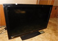 Sharp Aquos 53” Flatscreen TV, on stand