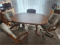 Dinning table and 4 chairs - table is 58" long
