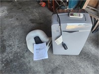 Portable air conditioner with window kit