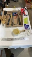 Wire brushes, straw broom head, hammers, hand