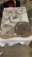 Decorative various serving dishes and trays .