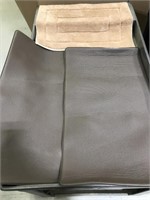 Pair of brown anti fatigue mats and bath rug