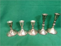 Sterling silver weighted candle sticks, 5 total.