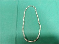 Seller states, genuine pearl necklace