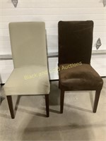 (2)White Cushioned Chairs With Differing Covers