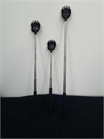 Three new extendable back scratchers