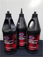 31 quart bottles of Carquest hydraulic jack oil