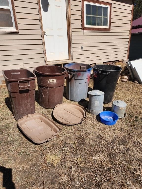 4 trash cans & chicken feeders