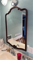 Antique dressing, mirror, hanging over the sink,