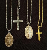 Four vintage religious necklaces including two