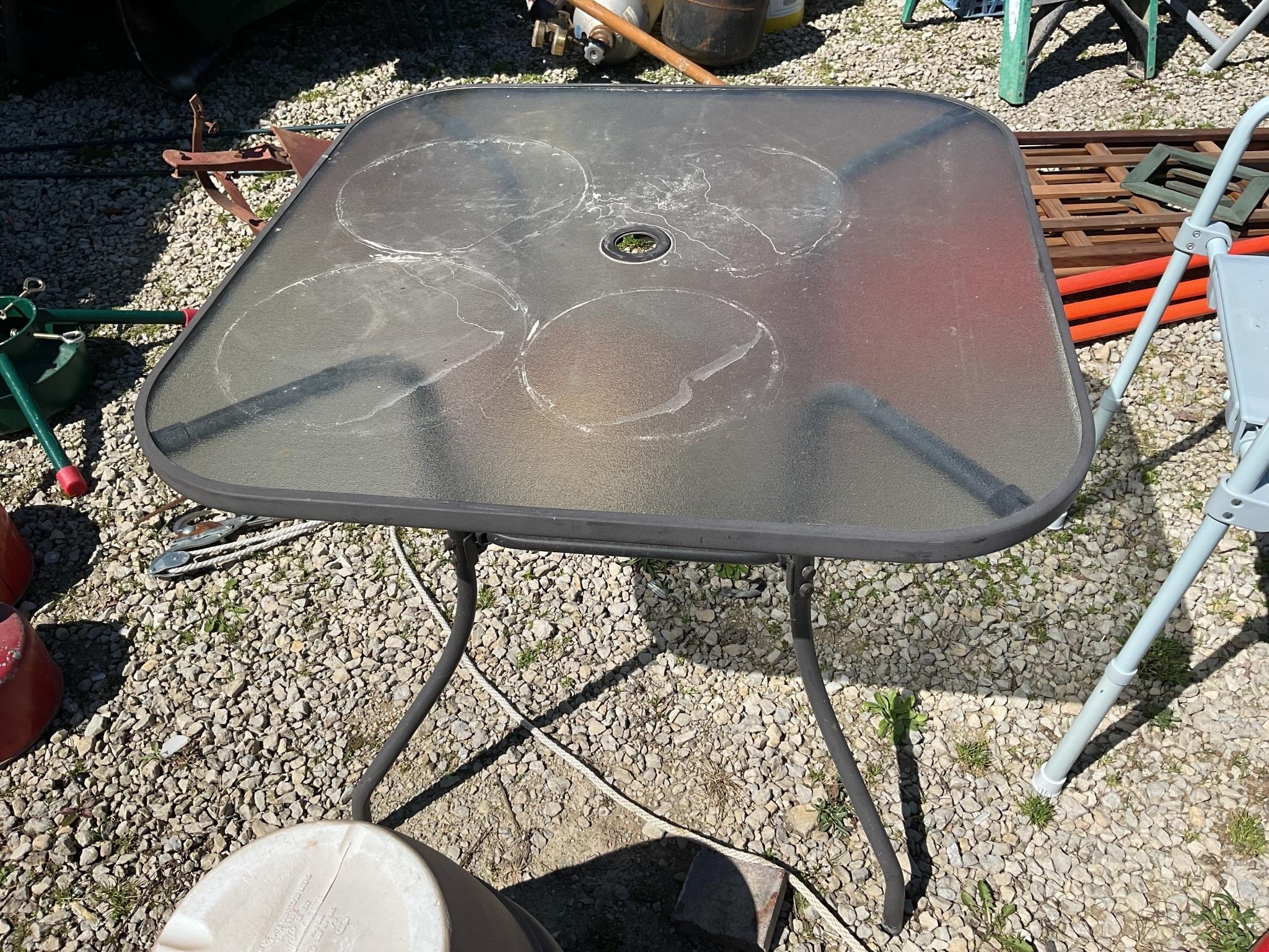 Glass top patio table