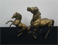Solid brass horses one is 10 in and one is 8 in