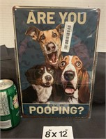 Tin sign Pooping