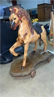 ANTIQUE SOLID WOOD HORSE W/ CAST IRON WHEELS