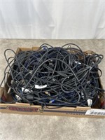 Assortment of computer cords and audio cables.