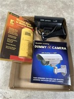 Dummy cameras and wireless alarm with motion