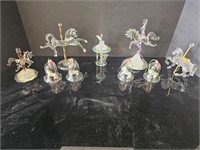 9 pieces of assorted carousel figurines & bells