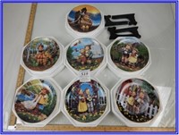 7 M J HIMMEL DECORATIVE PLATES WITH 4 STANDS