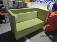 Green fabric upholstered lounge chair