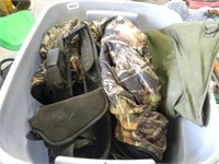 Tote of camo, some military, holster