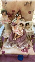 Porcelain dolls and baby buggy