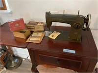 New Home Sewing Machine, cabinet, & attachments