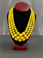 Yellow multi strand necklace