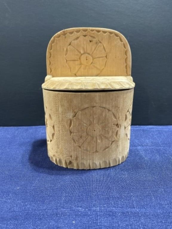 Wooden box with carved flowers