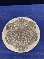 Ceramic plate with lace impression